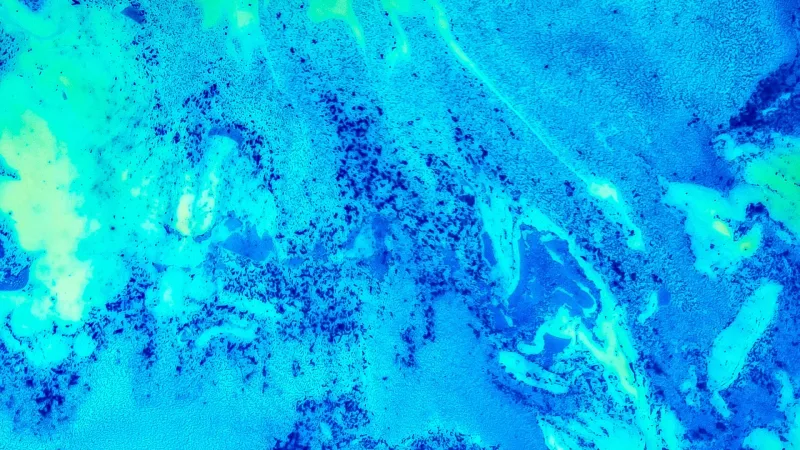 Textura abstracta con patrón celular turquesa y azul tipo malla