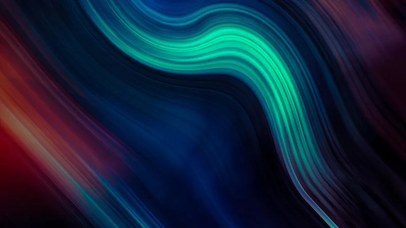 Fondo abstracto con ondas de luz azul, verde y roja fusionándose en diagonal