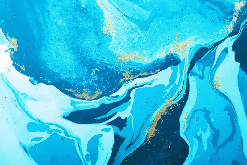 Textura abstracta de tinta azul y dorada con efecto marmolado usada como imagen destacada