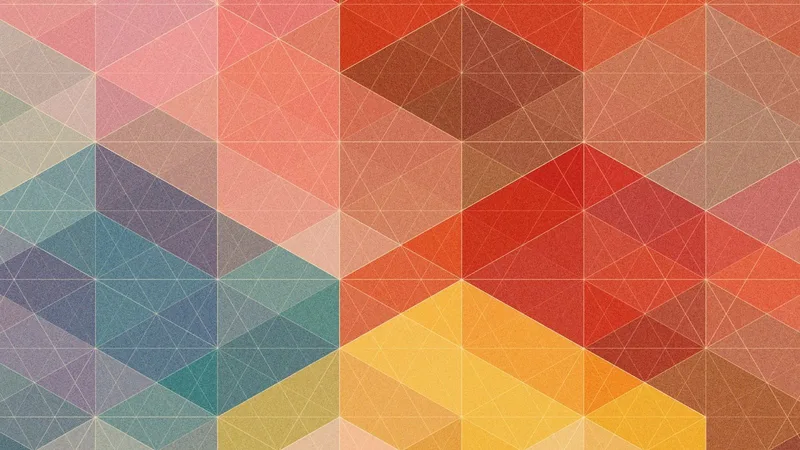 Mosaico de triángulos en rojo, amarillo, azul y turquesa con textura granulada